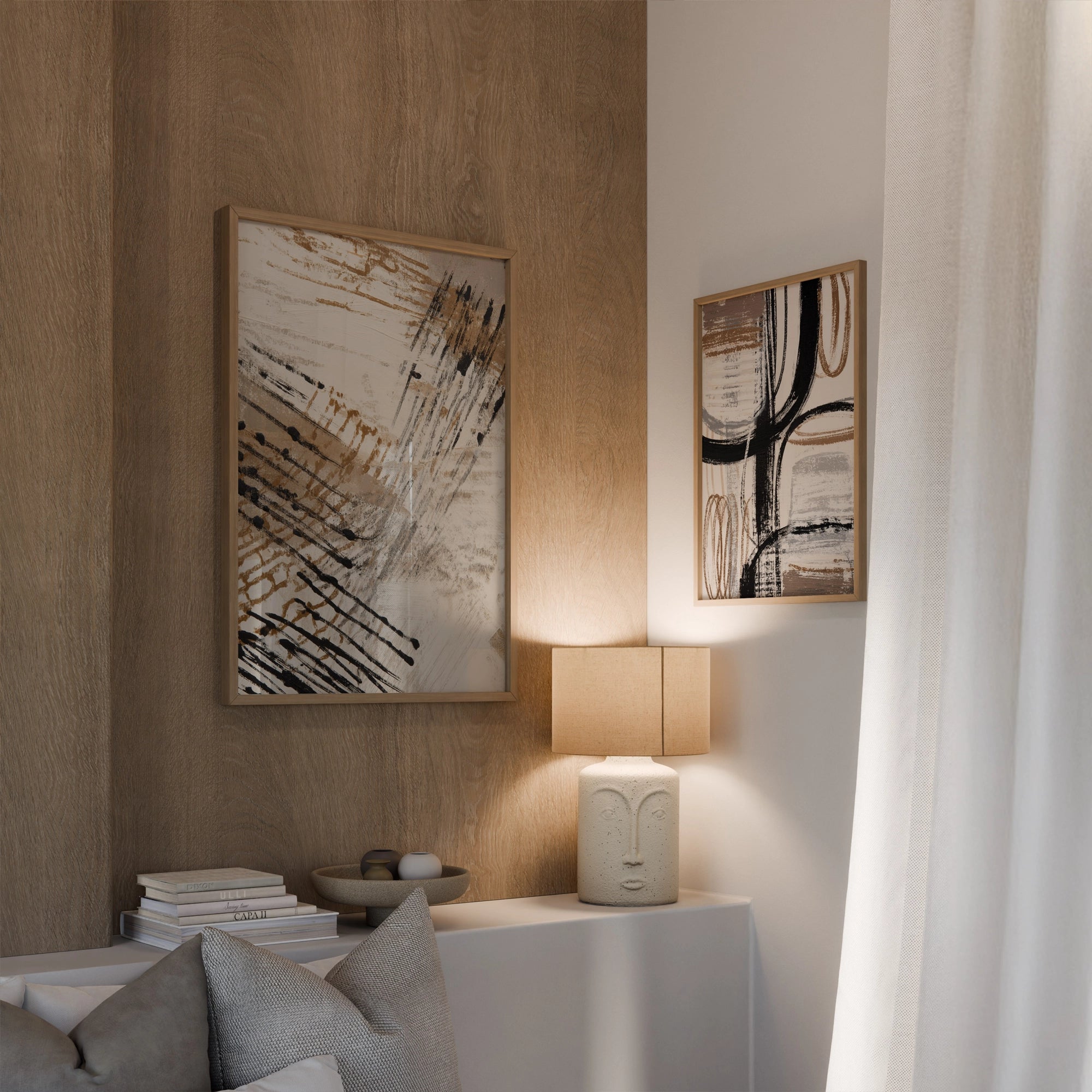 Set of abstract wall art prints in beige, black, and neutral tones, displayed in a modern living room with warm lighting and minimalist decor.