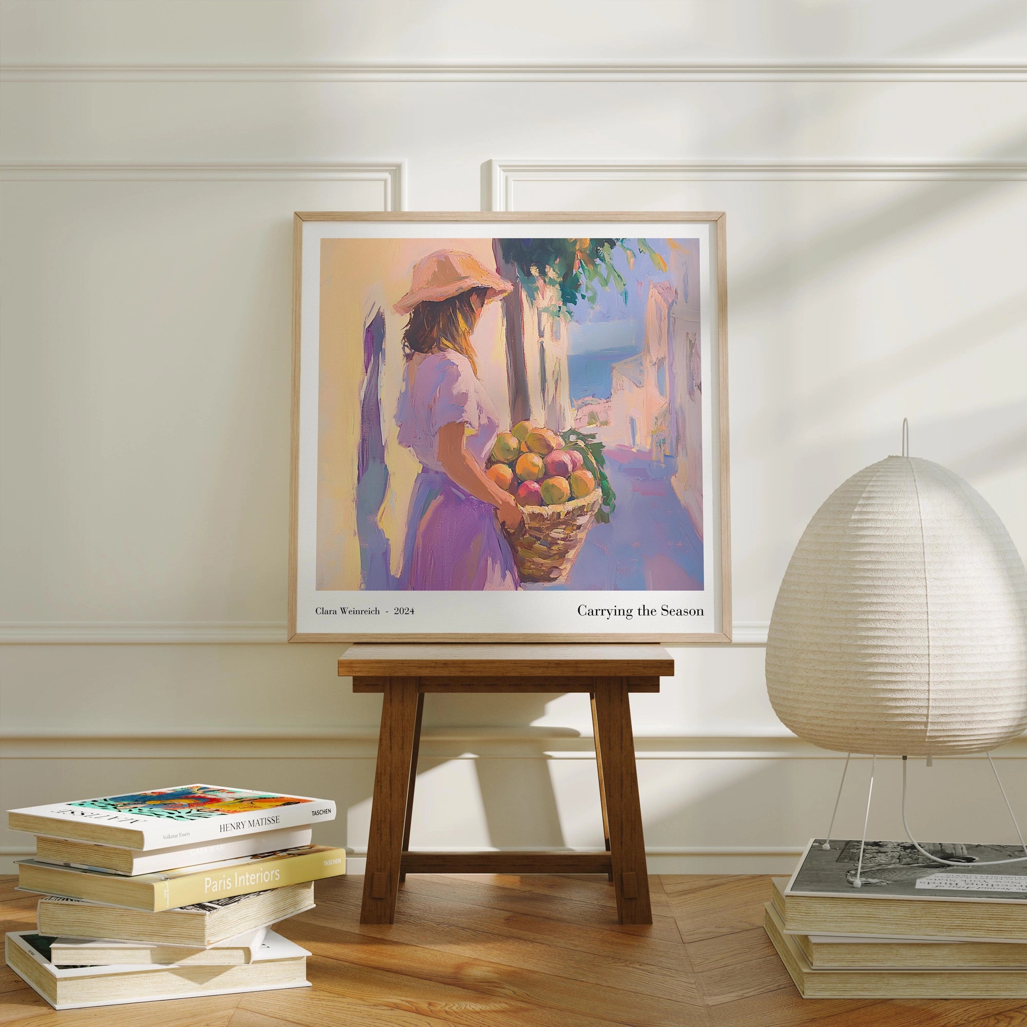 Impressionist painting of a woman carrying a basket of fruit in a Mediterranean street, displayed as framed wall art in a bright and modern interior.